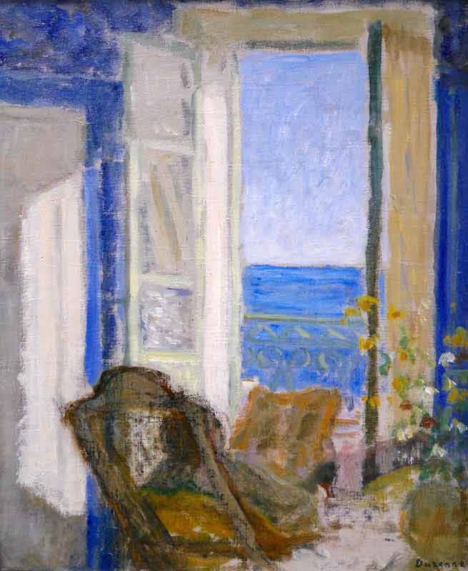 Seated woman viewing sea through open window. Vase of flowers to right foreground.